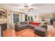 Open living room with sectional sofa, fireplace, and kitchen view at 5389 S Scott Pl, Chandler, AZ 85249