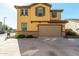 Two-story home with neutral exterior and garage at 16256 W Culver St, Goodyear, AZ 85338