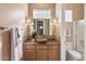 Updated bathroom with stone sink and tiled accents at 7473 E Soaring Eagle Way, Scottsdale, AZ 85266