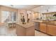 Eat-in kitchen with island and granite countertops at 7473 E Soaring Eagle Way, Scottsdale, AZ 85266