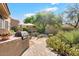 Outdoor kitchen and patio with desert landscaping at 7473 E Soaring Eagle Way, Scottsdale, AZ 85266