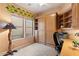 Versatile bedroom/office with a Murphy bed, built-in shelves, and a desk at 7473 E Soaring Eagle Way, Scottsdale, AZ 85266