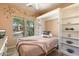 Charming bedroom with a Murphy bed, built-in shelves, and a desk at 7473 E Soaring Eagle Way, Scottsdale, AZ 85266