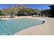 Relaxing community pool with surrounding patio and stunning desert backdrop at 7473 E Soaring Eagle Way, Scottsdale, AZ 85266