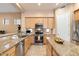 Updated kitchen with granite countertops and stainless steel appliances at 7473 E Soaring Eagle Way, Scottsdale, AZ 85266