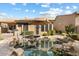 Stunning pool with rock waterfall feature at 7473 E Soaring Eagle Way, Scottsdale, AZ 85266