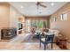 Living room with fireplace, large windows, and comfortable seating at 7473 E Soaring Eagle Way, Scottsdale, AZ 85266