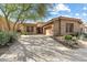 Front view of a two-story house with a large driveway at 7473 E Soaring Eagle Way, Scottsdale, AZ 85266