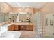 Spa-like bathroom with a soaking tub, dual vanities, and a glass-block shower at 7473 E Soaring Eagle Way, Scottsdale, AZ 85266