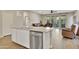 Island kitchen with granite countertops and stainless steel appliances at 30346 W Columbus Ave, Buckeye, AZ 85396