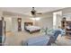 Cozy bedroom with carpeted floor, wooden bed frame, and ceiling fan at 30346 W Columbus Ave, Buckeye, AZ 85396