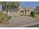 Single story home with stone accents and a two-car garage at 30346 W Columbus Ave, Buckeye, AZ 85396