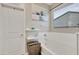 Bathroom with soaking tub, window, and built-in shelves at 30346 W Columbus Ave, Buckeye, AZ 85396