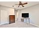 Spacious bedroom with ceiling fan, dresser and carpet flooring at 30346 W Columbus Ave, Buckeye, AZ 85396