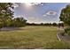 Scenic community park with grassy areas and trees at 30346 W Columbus Ave, Buckeye, AZ 85396