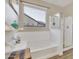 Bathroom with soaking tub, shower, and tile floor at 30346 W Columbus Ave, Buckeye, AZ 85396