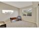Cozy bedroom with a comfortable chair and ample natural light at 30346 W Columbus Ave, Buckeye, AZ 85396