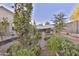 Lush garden with various plants and shade structure at 30346 W Columbus Ave, Buckeye, AZ 85396