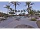 Community pool with picnic tables and palm trees at 30346 W Columbus Ave, Buckeye, AZ 85396