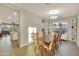 Bright dining room with hardwood floors and built-in shelving at 30346 W Columbus Ave, Buckeye, AZ 85396