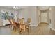 Bright dining room with wooden table and chairs at 30346 W Columbus Ave, Buckeye, AZ 85396