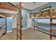 Playful bedroom with custom built-in bunk beds and shelves at 30346 W Columbus Ave, Buckeye, AZ 85396