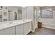 Modern bathroom with double vanity and a soaking tub at 30346 W Columbus Ave, Buckeye, AZ 85396