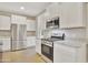 Modern kitchen with stainless steel appliances and granite counters at 30346 W Columbus Ave, Buckeye, AZ 85396