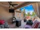 Relaxing patio with fire pit and wicker furniture at 10224 E Michigan Ave, Sun Lakes, AZ 85248
