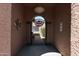 Covered entryway with an ornate metal gate leading to the backyard at 10224 E Michigan Ave, Sun Lakes, AZ 85248