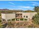 Aerial view of stucco home with pool and mountain views at 7823 E Celestial St, Carefree, AZ 85377