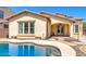Lovely backyard oasis featuring a kidney-shaped pool at 15409 W Corrine Dr, Surprise, AZ 85379