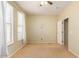 Simple bedroom with ceiling fan and neutral decor at 15409 W Corrine Dr, Surprise, AZ 85379