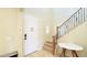Bright entryway with staircase and small round table at 15409 W Corrine Dr, Surprise, AZ 85379