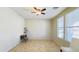 Spacious living room with large windows and tile floor at 15409 W Corrine Dr, Surprise, AZ 85379