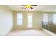 Bright loft bedroom with private balcony access at 15409 W Corrine Dr, Surprise, AZ 85379