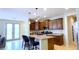 Eat-in kitchen with breakfast bar and access to backyard at 15409 W Corrine Dr, Surprise, AZ 85379
