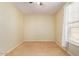 Well-lit bedroom with ceiling fan and neutral carpeting at 15409 W Corrine Dr, Surprise, AZ 85379