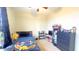 Cozy bedroom with a double bed, dresser, and shelving at 15409 W Corrine Dr, Surprise, AZ 85379
