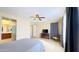 Bright bedroom with ceiling fan and en-suite bathroom at 15409 W Corrine Dr, Surprise, AZ 85379