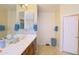 Clean bathroom with double vanity and updated fixtures at 15409 W Corrine Dr, Surprise, AZ 85379