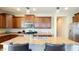 Well-equipped kitchen featuring wood cabinets and stainless steel appliances at 15409 W Corrine Dr, Surprise, AZ 85379