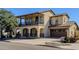 Two-story home with balcony, two-car garage, and landscaped yard at 15409 W Corrine Dr, Surprise, AZ 85379