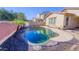 Inviting kidney-shaped pool with flagstone decking at 15409 W Corrine Dr, Surprise, AZ 85379