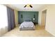Spacious bedroom with ceiling fan and accent wall at 15409 W Corrine Dr, Surprise, AZ 85379