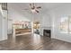 Living room with a fireplace, sliding door to the pool, and kitchen views at 2726 N Ricardo --, Mesa, AZ 85215