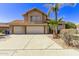 Two-story house with a three-car garage and palm trees at 2726 N Ricardo --, Mesa, AZ 85215