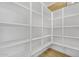 Spacious walk-in pantry with ample shelving for storage at 22427 E Oriole Way, Queen Creek, AZ 85142