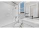 Clean bathroom with a bathtub, toilet and white vanity at 22427 E Oriole Way, Queen Creek, AZ 85142