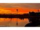 Stunning sunset over a tranquil lake at 22427 E Oriole Way, Queen Creek, AZ 85142